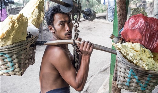 Half way down at the weigh station a miner finds out how much this load will earn for his family.