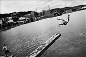 A man leaps into harbour on Wellington city waterfront. This is a favourite spot for swimmers, only minutes from the CBD. Wellington is a pocket-sized city, dominated by the varied surrounding coastline. December 2011.: by cwyatt, Views[471]