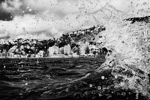 Waves converge in Wellington's Oriental Bay. The bay and sand beach are hugely popular with city beach-goers. August 2012.