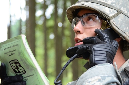 The team leader radios in details of their first combat simulation. Team leaders are expected to keep their superiors up to date on the details of the combat senario including any casualties and their ammo and water supplies. 
