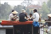 These workers taking a lunch break on their boat floating on the red river reminded me of an old picture taken 50 years ago in Italy when workers were having a break to eat their 