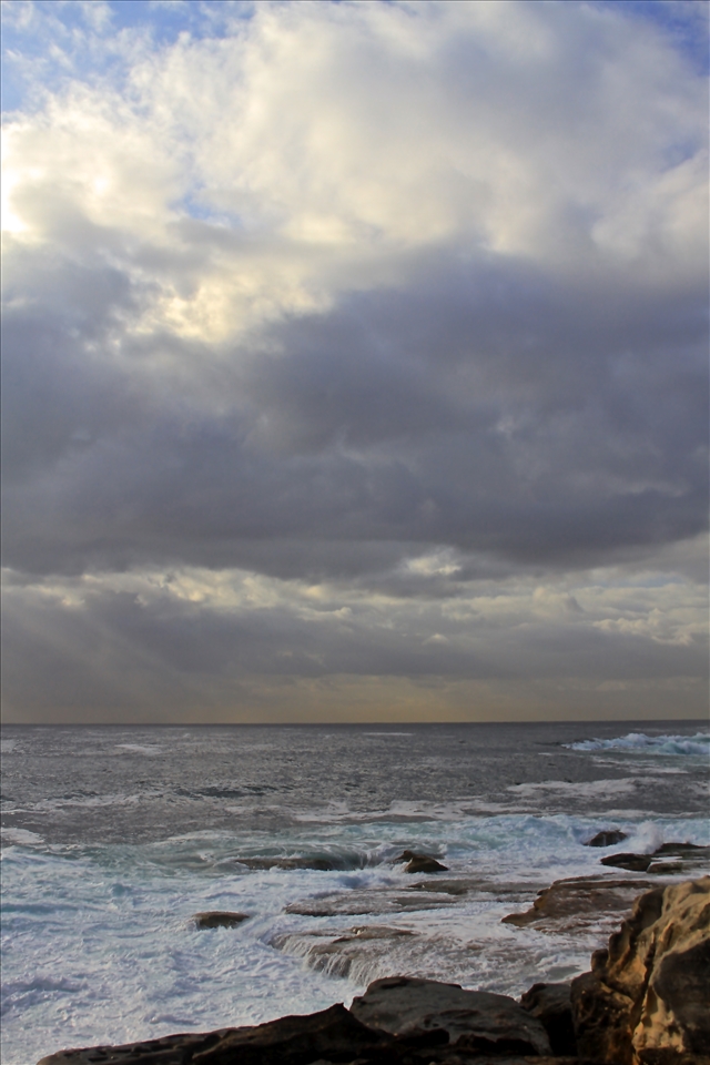 The sky was cloudy while the sea was calm but powerful