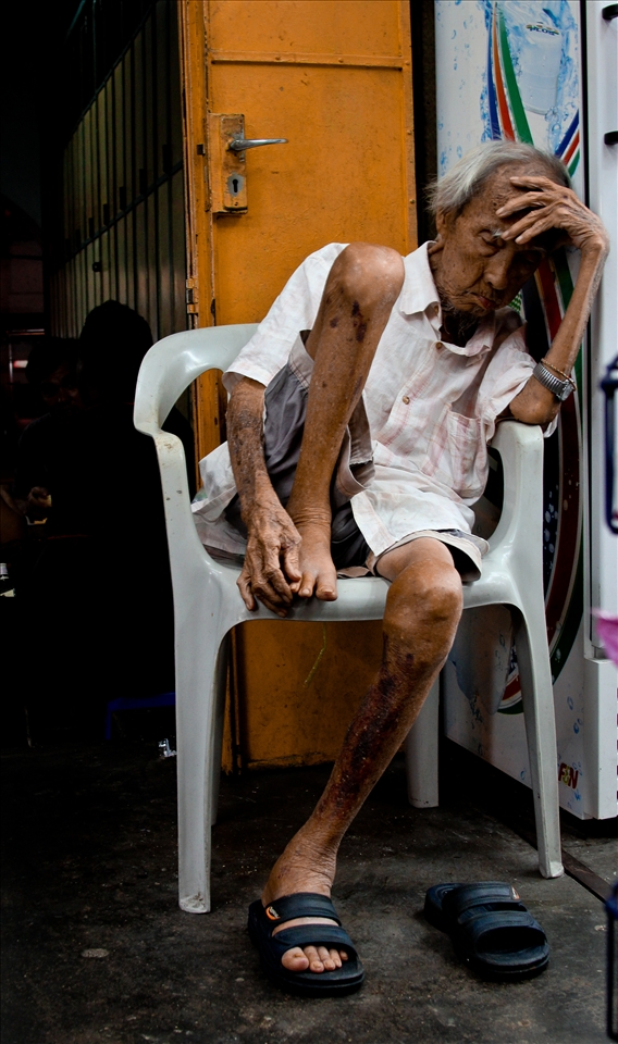 Dreaming of love long past, this store keeper remains open.