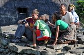 What is that, Sir ? – A French tourist is showing pictures taken by his camera to some of Wae Rebo children.: by dananwahyu, Views[175]