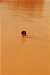 Young boy fishes in dirty lake, he caught a catfish after this photo was taken!: by dane, Views[288]