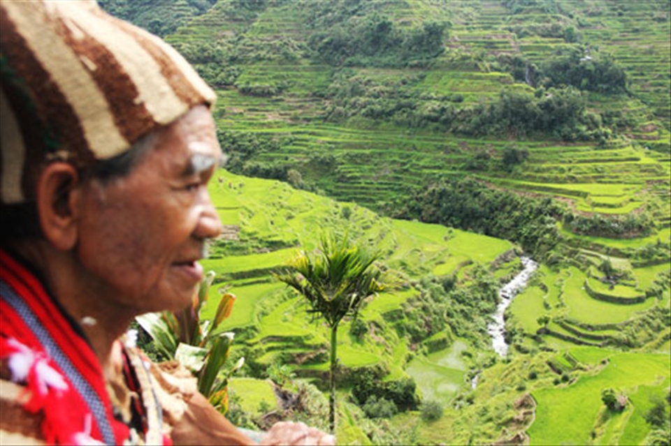 A native and the rice terraces are living examples of Banaue's heritage.