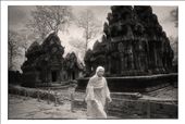 Buddhist monk walks past the ruins of Banteay Srei: by dangian, Views[290]