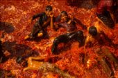 Children play in a pool of dyed water in a Hindu temple during a Holi ritual: by dangraetzer, Views[943]