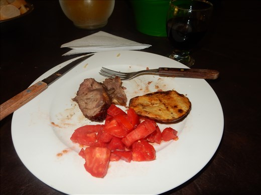 The Argentine folks really know how to do  BBQ or asado. Meat and potatoes cooked over a wood fire, chopped tomatoes and for dessert, an apple. Doesn't get much simpler than that. 