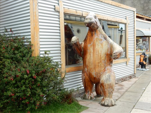 The case of the street sign creature is solved. It's an extinct prehistoric animal from the area called a Milodon. 