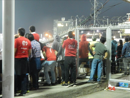 Estadio Monumental served as a makeshift prison in 1973 during the time dictator Augusto Pinochet ruled making it  one of the most infamous sports arenas in the world. It opened in 1938 and to say it's showing its age would be an understatement. Barbed wire and plexiglass separate each section obscuring the view of the first 10 or 15 rows of seats in the entire stadium so nobody sits in them. An additional section of seating was left empty in remembrance of the thousands that were beaten, tortured and murdered by Pinochet leaving minimal seats available in the section we were  quarantined. We stood the entire game catching the occasional glimpse of the action and listened to the rowdy Chilean fans sing songs and cheer for their team. 