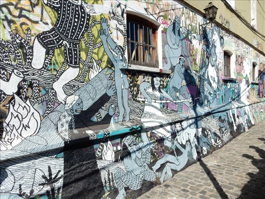 More street art. This common scene has the Spaniards conquering the Chilean natives in not such a nice way. 