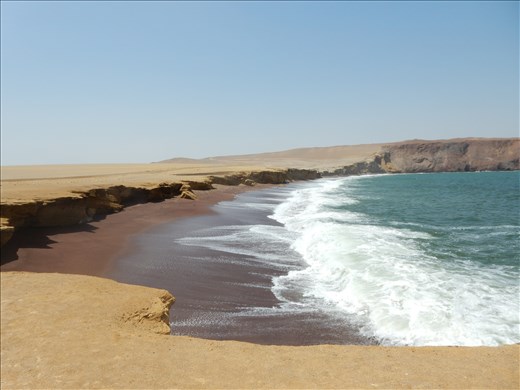 Playa Roja named for the red lava sand beach. 