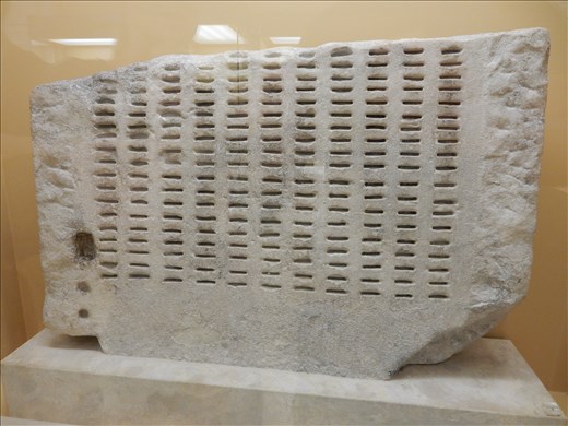 Jury service was selected using this allotment machine called a kieroteria. Into the slots were inserted bronze identification tickets carried by citizens eligible for jury service. Black or white bronze balls were inserted into the top and depending what color ball emerged at the bottom you were either selected or rejected for jury service. 