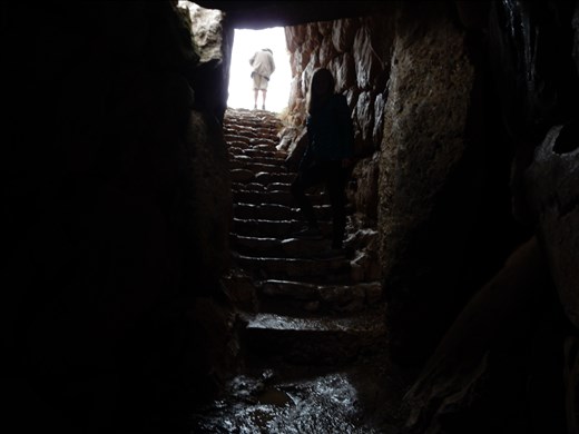 Going deep down into a cistern at the citadel of Mycenae. 