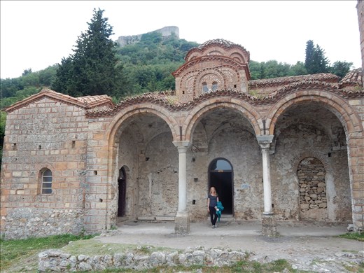 One of the many monasteries of Mystras with the Byzantine Mystras fortress in the background. 