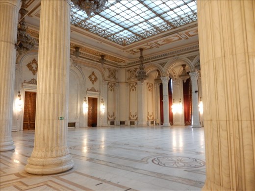 Inside the Palace of the Parliament. Probably the biggest waste of money and space we have ever seen. This is the ball room. Portraits of Nicolae and Elena Ceausescu were supposed to be at opposite ends but they were executed by firing squad before it could be completed. 