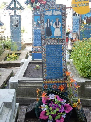 This headstone reads:
Underneath this heavy cross lies my mother in law. Had she lived three days more I'd be here and she would be reading this to you passing by. Try not to wake her up for if she comes back home she'll bite my head off. But I'll act in the way that she will not return. Stay here my dear mother in law. 