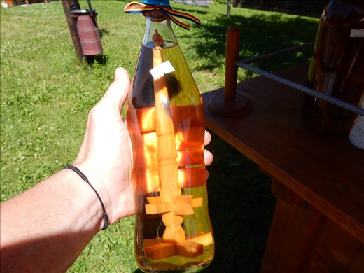 Plum brandy is very popular in Romania. A mulberry wood spindle is placed inside the bottle to add color. Legend has it the spindle is a puzzle if solved will result in a broken heart. 