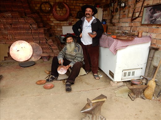 Visited some gypsies on the way to Sighisoara. They are well known coppersmiths that have work in a Vienna art gallery. They also sell their wares on the side of the road. 