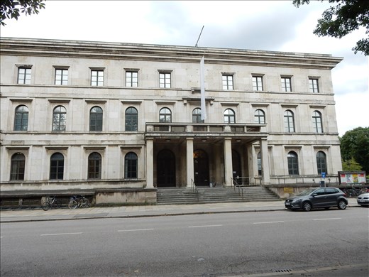 Nazi Headquarter and Hitlers office where he gave speeches on the balcony. You can still see the bolt holes in the wall that held the giant golden eagles. The government is unable to demolish the building because it is too strong and they can't blow it up because it would risk damaging surrounding buildings so they turned it into a music school and built the Munich Documentation Center for the History of National Socialism. The City of Munich also refuses to make any repairs to it or maintain the grounds.  