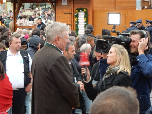 The mayor talking to the media about the big moment that will kick-off the 16 day festival where 7.7 million liters of beer will be served. 