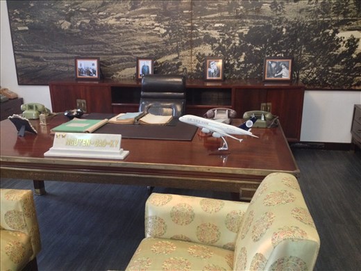Presidents desk. His wife was a ex airline stewardess explaining the airplane on the desk. 