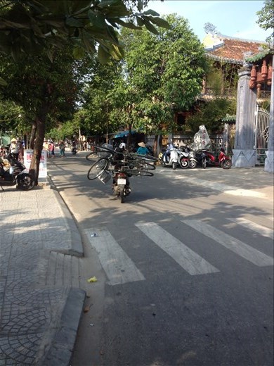 Rode back to town to drop off our bikes and watched a girl haul all three away on a motor scooter. 