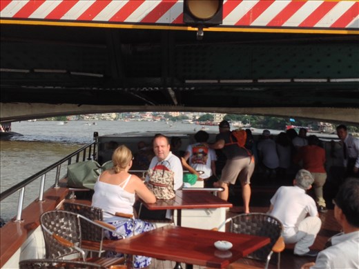 Only in Bangkok would you have to duck going under a bridge on a sight seeing cruise. 