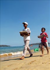 Mientras tanto...
Y mientras ellos vienen a tu casa a divertirse, a jugar entre mar y arena, tú, como servil anfitrión, caminas de punta a punta, para ofrecer por algo de dinero, aperitivos para la ocasión.  

In the mean while....

And while they come to your home to have fun, to play between sun and sea;  you, as a servile host, walk from side to side, to provide for some cash, appetizer for the occasion.: by daniela_amodio, Views[719]