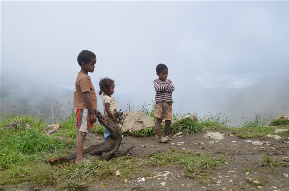 Some children play, but many wait. Will there be food tonight? 