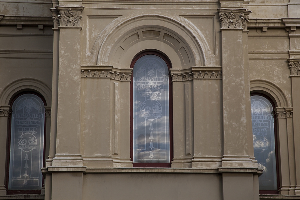 The port city of Fremantle has a proud history. Not only was it the first colony in Australia to be established without convict settlers it was also the early gateway to the vast expanses and riches of Western Australia. The windows of the town hall convey a little of this history with key dates in the stain glass windows backed by the reflection of the afternoon clouds.