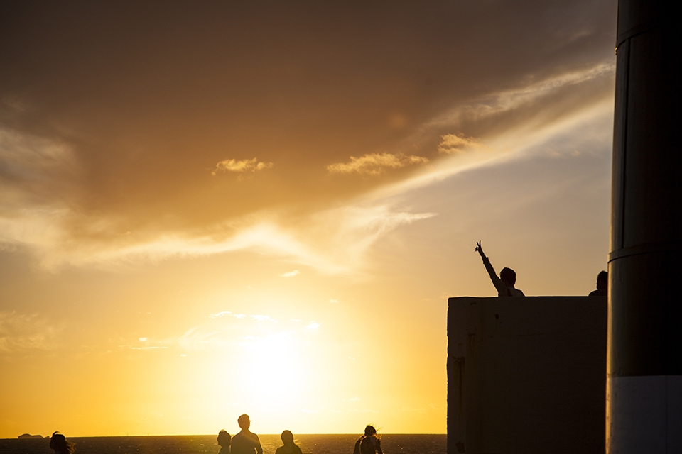 Tourist frolic in the setting sun at the South Mole Lighthouse. Fremantle has many attractions but one of the standouts are defiantly its spectacular sunsets.