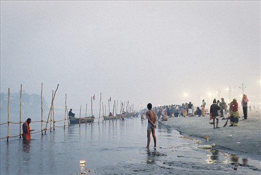 Contemplation.
A young man looks on as pilgrims in their thousands partake in the 5am ritual cleansing.
Over a 55 day period, more than 120 million people traveled to the confluence of India's of three holiest rivers; Mother Ganga, Yamuna and the mythical Saraswati.
I was fortunate to be in India at the time. The Maha Kumbh Mela, thousands of years old, and holiest of all Hindu Festivals occurs only every twelve years