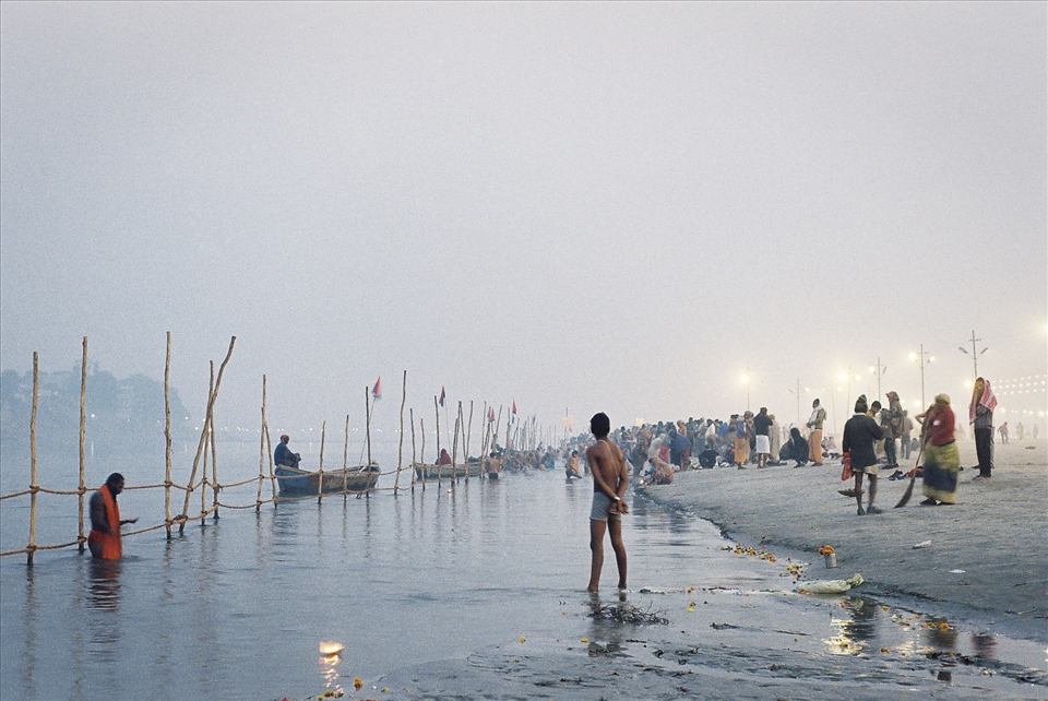 Contemplation.
A young man looks on as pilgrims in their thousands partake in the 5am ritual cleansing.
Over a 55 day period, more than 120 million people traveled to the confluence of India's of three holiest rivers; Mother Ganga, Yamuna and the mythical Saraswati.
I was fortunate to be in India at the time. The Maha Kumbh Mela, thousands of years old, and holiest of all Hindu Festivals occurs only every twelve years