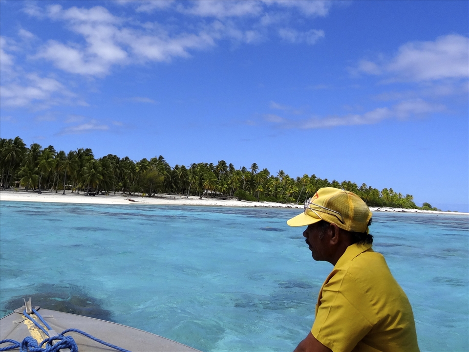 On our water taxi, the mayors brother navigating the reef