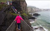 A group of tourists nervously cross the Carrick-a-Rede Rope Bridge after waiting in line in the pouring rain for over an hour. The bridge, which was originally constructed as a safe passage for salmon fisherman from the mainland to the tiny island of Carrick-a-Rede, hangs 98 ft above the ocean.

: by daniellemerchant, Views[513]