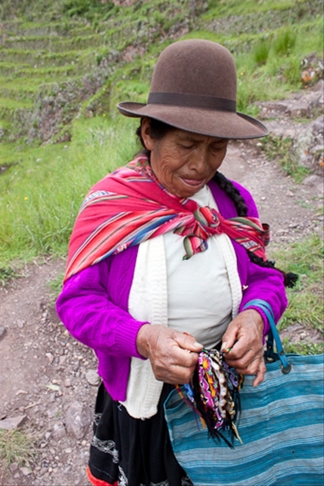 Amelia walks the steep Pisac  ruins selling bracelets to tourists.