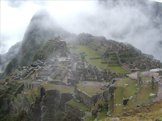 The early morning mist clears to reveal the ancient citadel of Machu Picchu