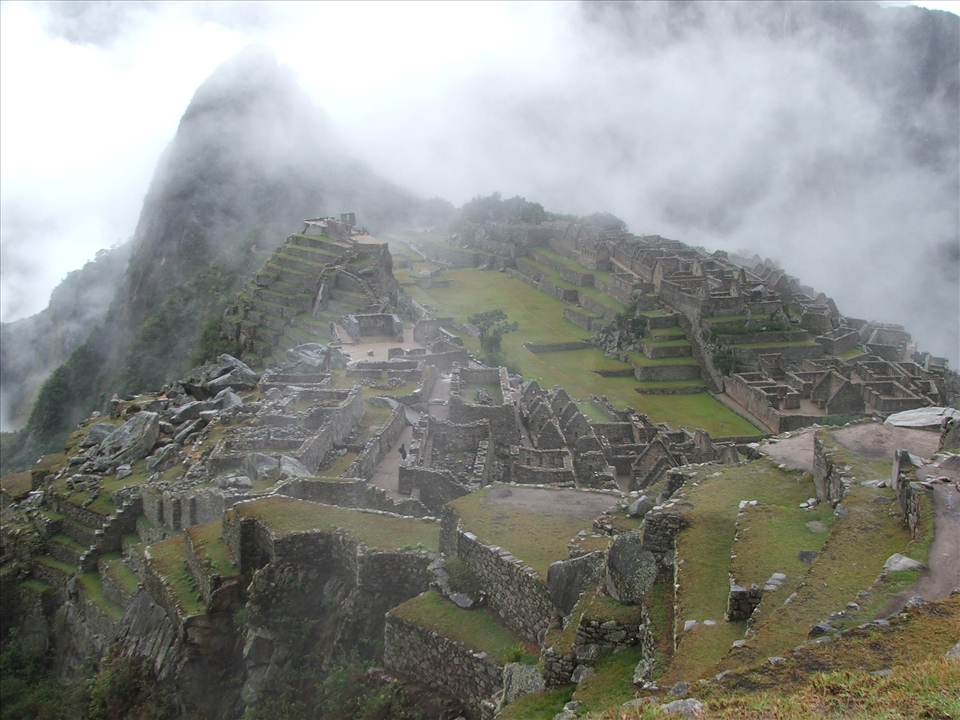 The early morning mist clears to reveal the ancient citadel of Machu Picchu