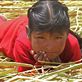 A young girl pierces my camera lens on a reed island on Lake titikaka. Views[215]