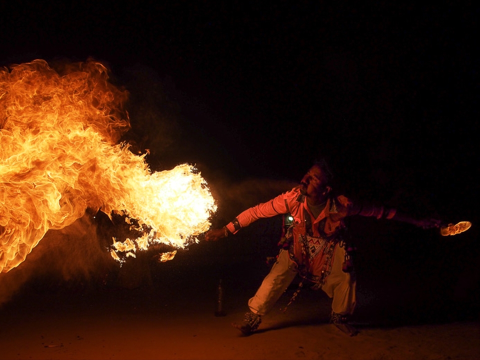 Entertainment in rural Rajasthan. In a world of big screen televisions and high speed internet, it can be a relief to experience some hands on fire breating. The lack of electricity and lights makes it a natural choice for late night entertainment.
