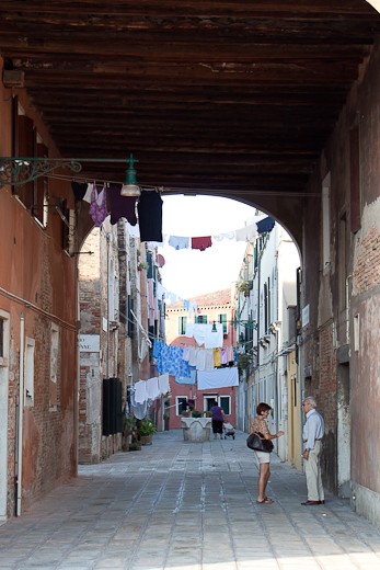 Life of a Venetian: Two people have a lazy afternoon conversation.