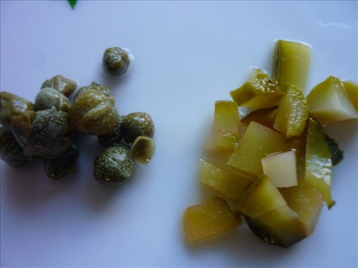 Capers and sliced pickles.