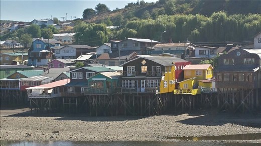 Patafitos on chiloe.  Boats are parked underneath. 