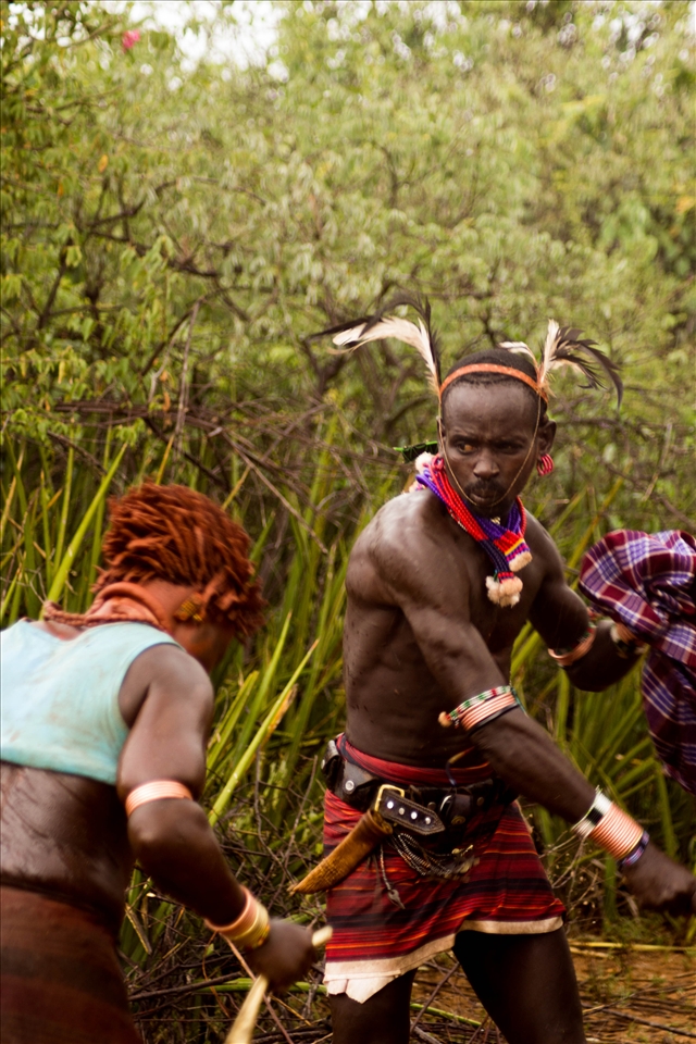 The women handles the sticks to the men who bit them mercilessly. If a man refuses to beat a woman, she gets angry and spit on him.