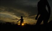 A young girl who doesn't know what awaits her as she grow up, plays under the beautiful dusk of Hamer.: by dav1, Views[390]