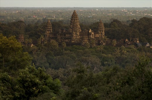 Ankgor Wat, at a height of 700 feet towers above the surrounding trees.