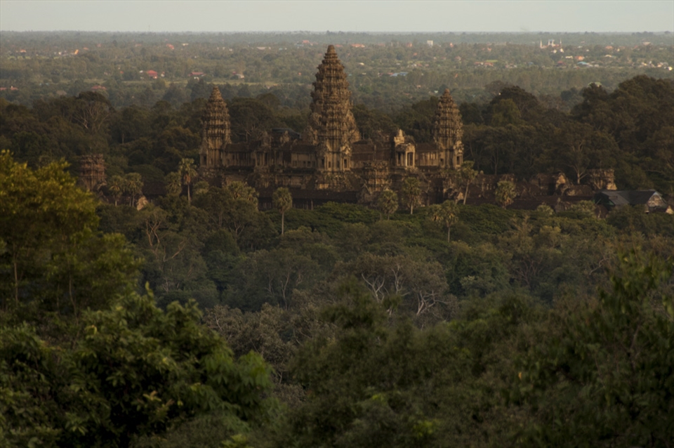 Ankgor Wat, at a height of 700 feet towers above the surrounding trees.