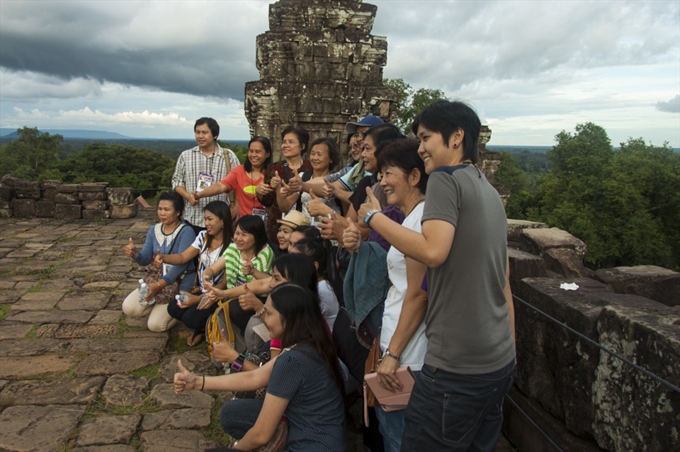 Two million tourist visit Angkor annually causing sandstone to wear out quickly.